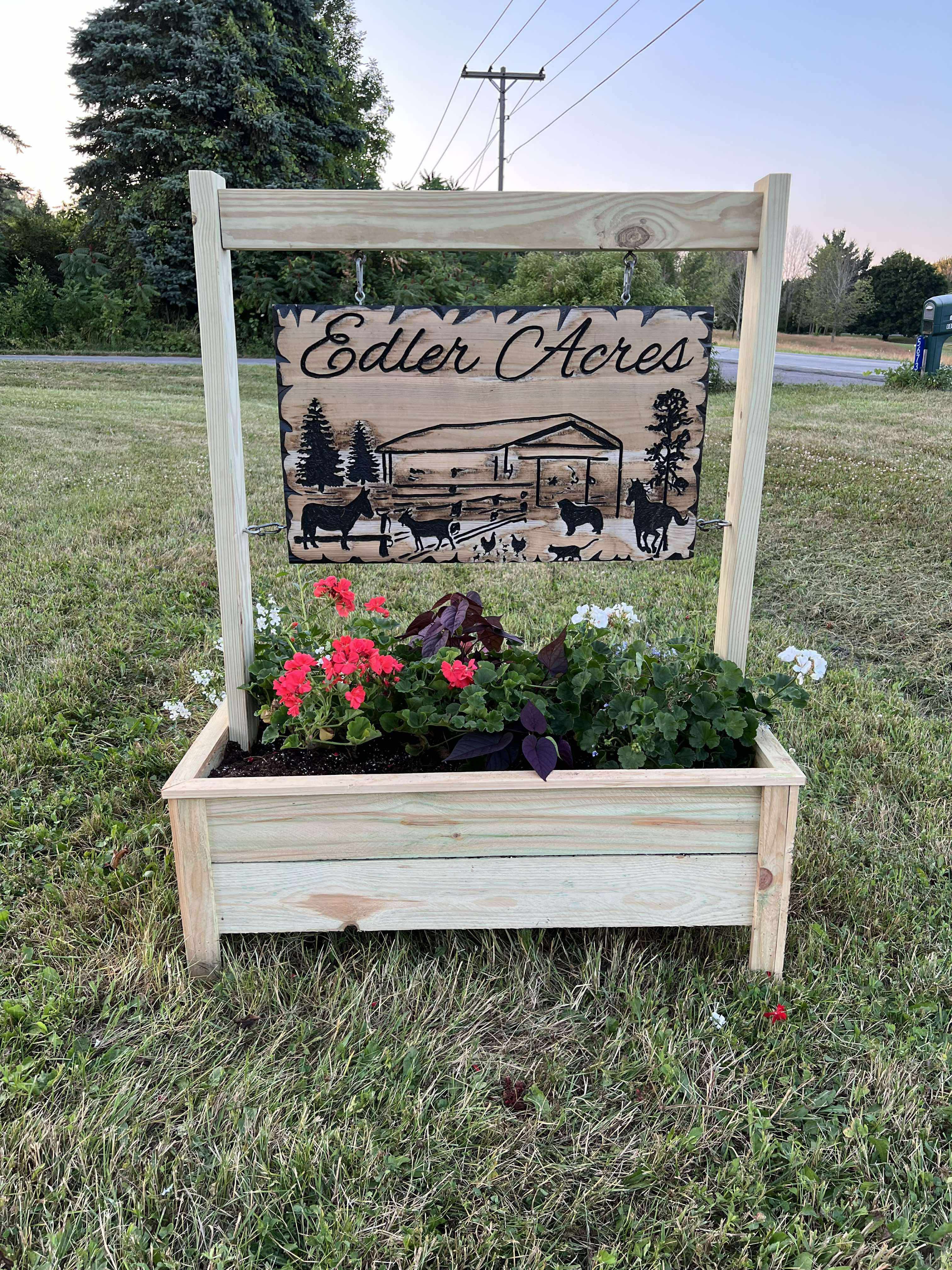 A Planter With A Sign